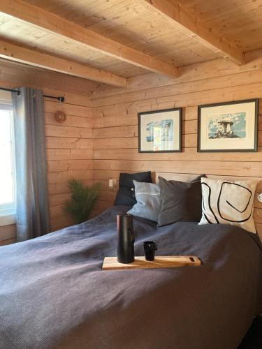a bedroom with a bed with a tray on it at Fishermans cabin in Lofoten, Stamsund in Stamsund