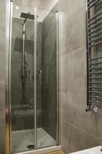 a shower with a glass door in a bathroom at VILLA AMBROSIA 172 A in Terracina