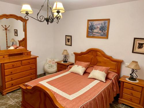 En eller flere senge i et værelse på Alojamiento Rural Mar de Olivos
