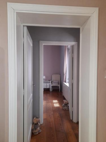 an empty hallway with two stuffed animals in a room at La maison de nonnì in Buonconvento