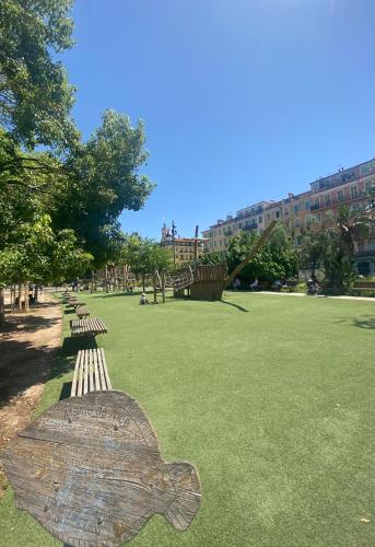 a park with a bench with a turtle on it at Duplex Cosy au Cœur du Vieux-Nice in Nice