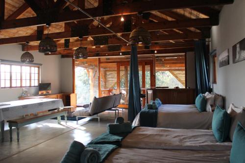 a bedroom with two beds and a piano in it at Ikamu's lodge in Germiston