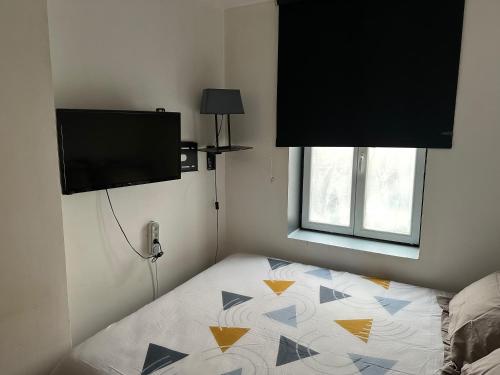 TV a/nebo společenská místnost v ubytování L'Escale des Weppes, appartement 40m2