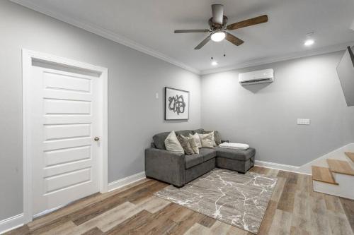a living room with a couch and a ceiling fan at Lookout Escape - Top of Lookout Mountain in Lookout Mountain