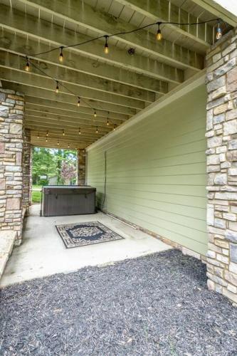 a garage with a green garage door with a rug at Lookout Escape - Top of Lookout Mountain in Lookout Mountain
