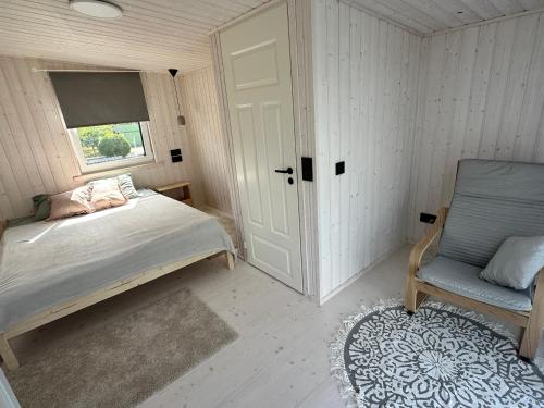 Una cama o camas en una habitación de Fully equipped new tiny-house