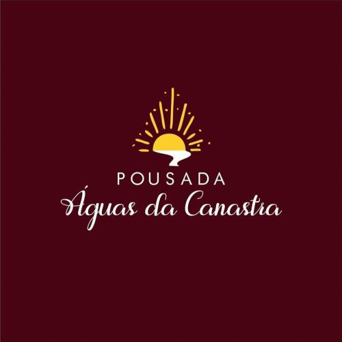 a logo for a tourism company with a sunset at Pousada Águas da Canastra in Vargem Bonita