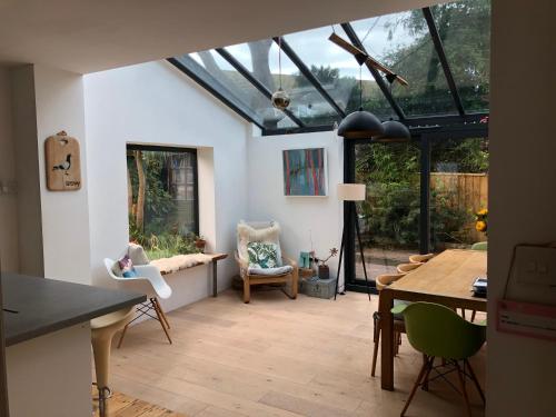 a living room with a conservatory with a glass roof at Sunnyview 5-Bed House in Kingsbridge with parking in Kingsbridge