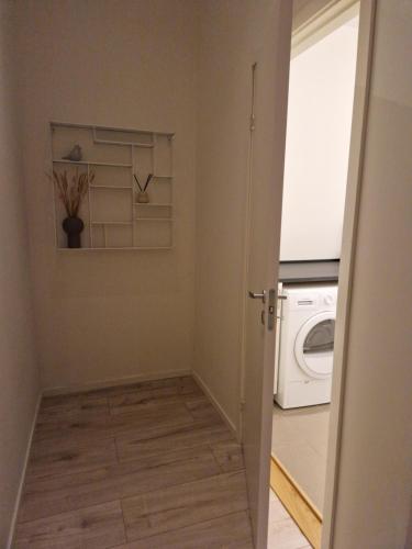 a laundry room with a washer and dryer at Lorans in Perstorp