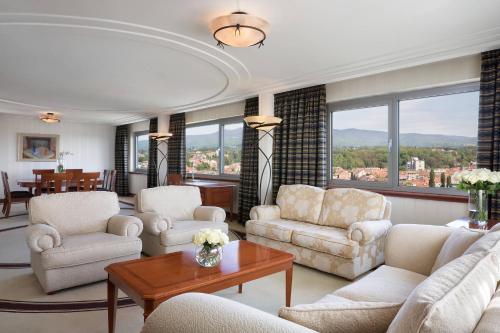 a living room with couches and chairs and a table at The Westin Zagreb in Zagreb