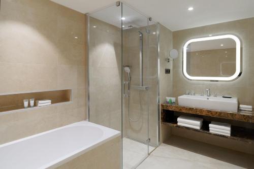 a bathroom with a shower and a sink at The Westin Zagreb in Zagreb