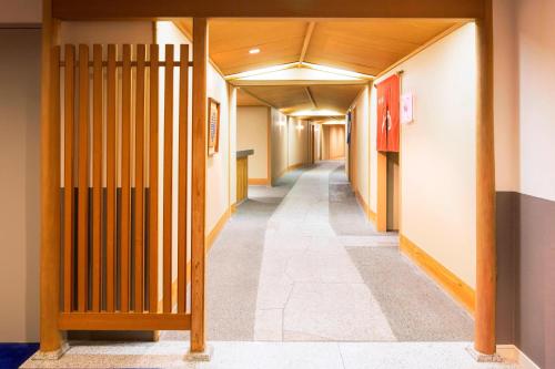 a hallway of an office building with wooden dividers at Sheraton Grande Tokyo Bay Hotel in Urayasu