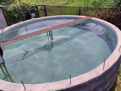 una gran piscina alrededor en Welcome Guest House, en Tokmok