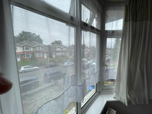 a window with a view of a city street at Nharakat Mansion in Southampton