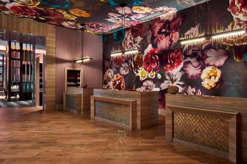 a lobby with a flower mural on the wall at SpringHill Suites by Marriott Nashville Downtown/Convention Center in Nashville