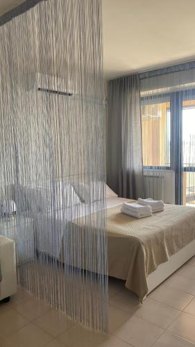 a bedroom with a bed with a glass wall at Casa Valentina 2 in Perugia