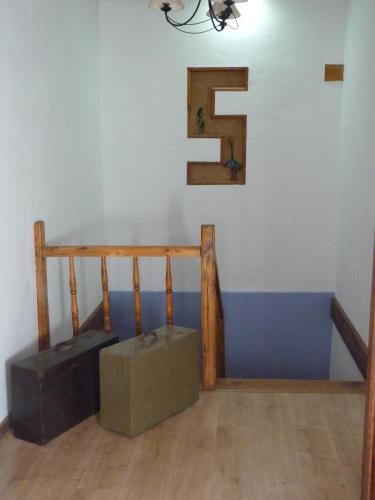 a room with a staircase and a stair case at Hotel Rural La Rosa de los Tiempos in Carneros