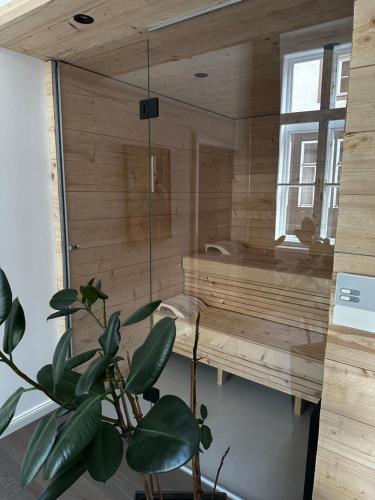 a room with a sauna with a potted plant at Luxury City Apartment Downtown Vienna in Vienna