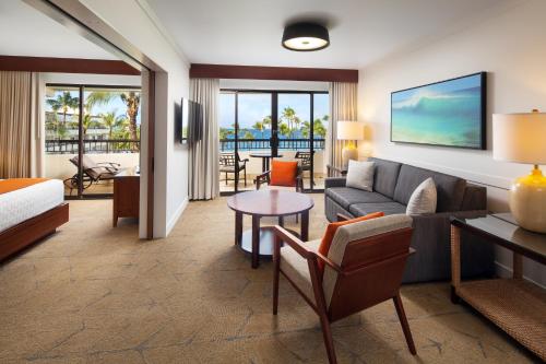 a living room with a bed and a couch at Sheraton Maui Resort & Spa in Lahaina
