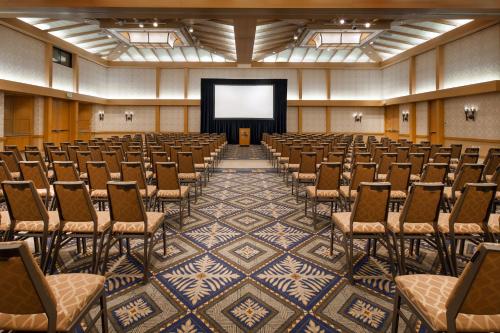 an empty lecture hall with chairs and a screen at Sheraton Maui Resort & Spa in Lahaina