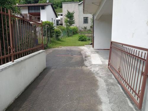an empty alley in a house with a fence at Dream House in Clusone