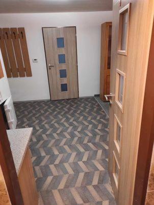an empty room with a door and a room with a floor at Apartmán Dobrá mysl in Hostinné