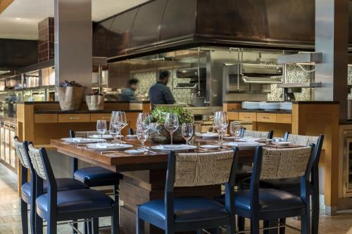 a table with wine glasses on it in a kitchen at The Ritz-Carlton, Dallas in Dallas