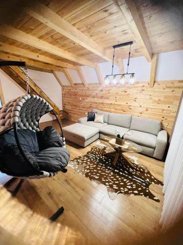 a living room with a couch and a swing at Prima Vista in Žabljak
