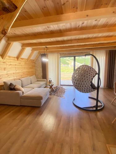 a living room with a couch and a chair at Prima Vista in Žabljak