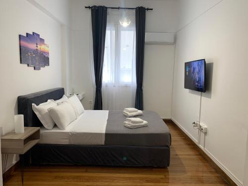Postel nebo postele na pokoji v ubytování Aura Apartment at Kolonaki