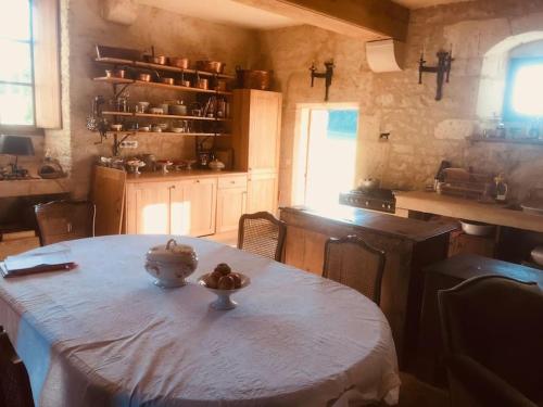 a kitchen with a table with a bowl on it at Manoir de Pimelles-Bourgogne-Chablis-2h15 Paris in Pimelles