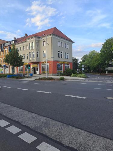 a building on the side of a street at Pension Winter Obergeschoss in Senftenberg