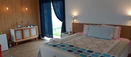 En eller flere senge i et værelse på Pousada Sonho do Campo