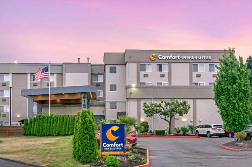 a building with a car parked in front of it at Comfort Inn & Suites Pacific - Auburn in Auburn
