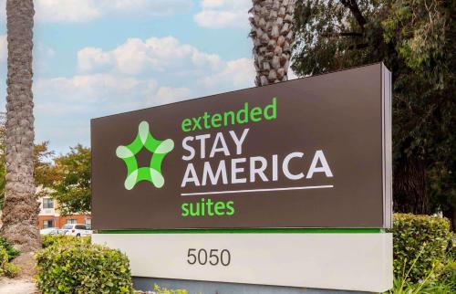 an extended stay america sign in a parking lot at Extended Stay America Suites - Orange County - Huntington Beach in Huntington Beach