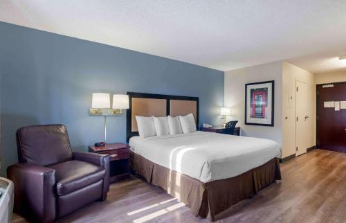 a hotel room with a bed and a chair at Extended Stay America Suites - Los Angeles - Torrance Blvd in Torrance