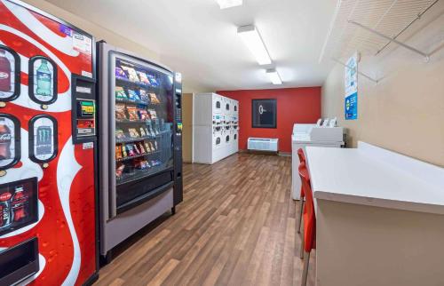 a room with a coca cola machine in a store at Suburban Studios in Oklahoma City