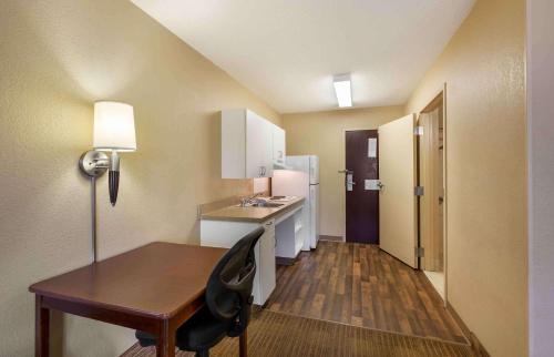 a small room with a desk and a sink at Extended Stay America Suites - Cleveland - Brooklyn in Brooklyn