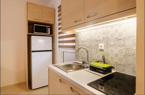 Kuchyň nebo kuchyňský kout v ubytování Marathon Luxury Suites - Studio