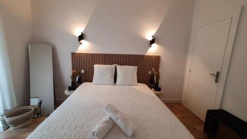 Letto o letti in una camera di Appartement au calme T3 RDC - Quartier de France