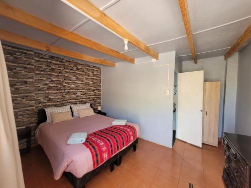 Una cama o camas en una habitación de Hospedaje Rural Casa de Felix