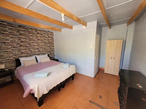 Una cama o camas en una habitación de Hospedaje Rural Casa de Felix