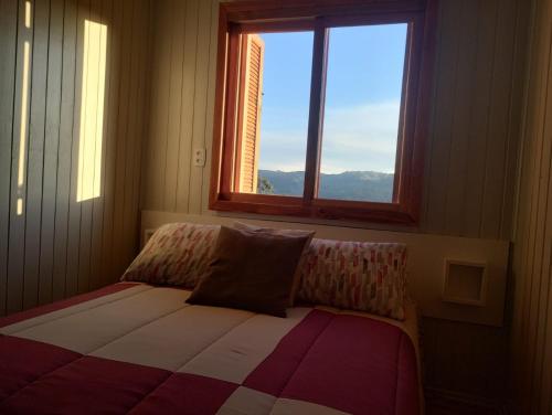 Postel nebo postele na pokoji v ubytování Gramado Família