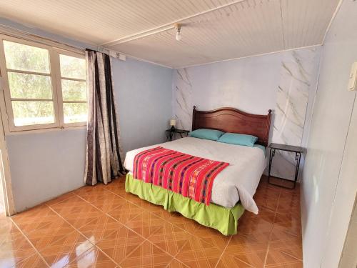 Una cama o camas en una habitación de Hospedaje Rural Casa de Felix