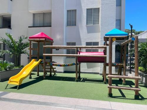 a playground with a slide and a play structure at Encanto urbano con la mejor vista y ubicación ! in Cúcuta