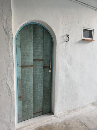 a door in the side of a building at Las heliconias 3 moderno loft in Oaxaca City