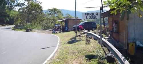 a car parked on the side of a road at FARILA LODGE in Kelimutu