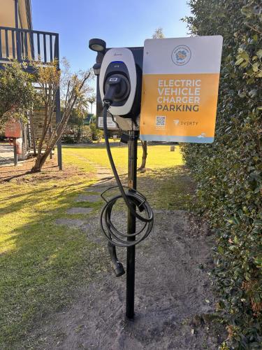 a security camera on a pole next to a sign at South Coast Retreat in Greenwell Point