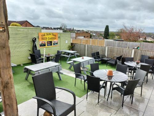 a patio with tables and chairs on a roof at THE NEW INN Newton Derbyshire in Tibshelf