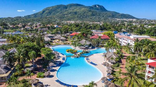 an aerial view of the resort with a mountain in the background at Marien Puerto Plata in San Felipe de Puerto Plata